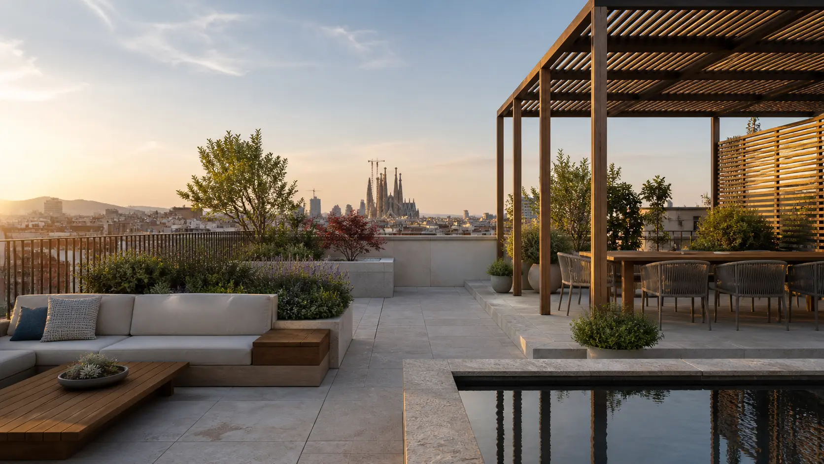Azotea comunitaria en Barcelona con pérgola, jardineras y vistas a la ciudad